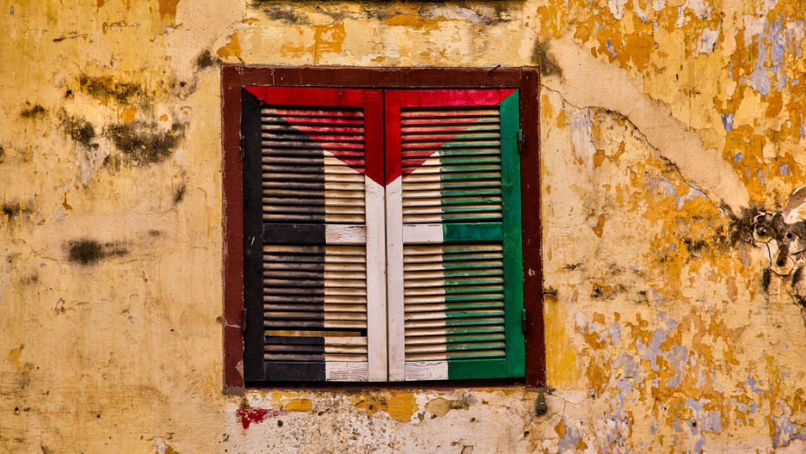 A Palestinian flag across window shutter in Tangiers in Morocco.