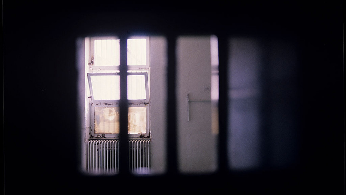 A small window with vertical bars inside Iran's Evin prison in 1986.