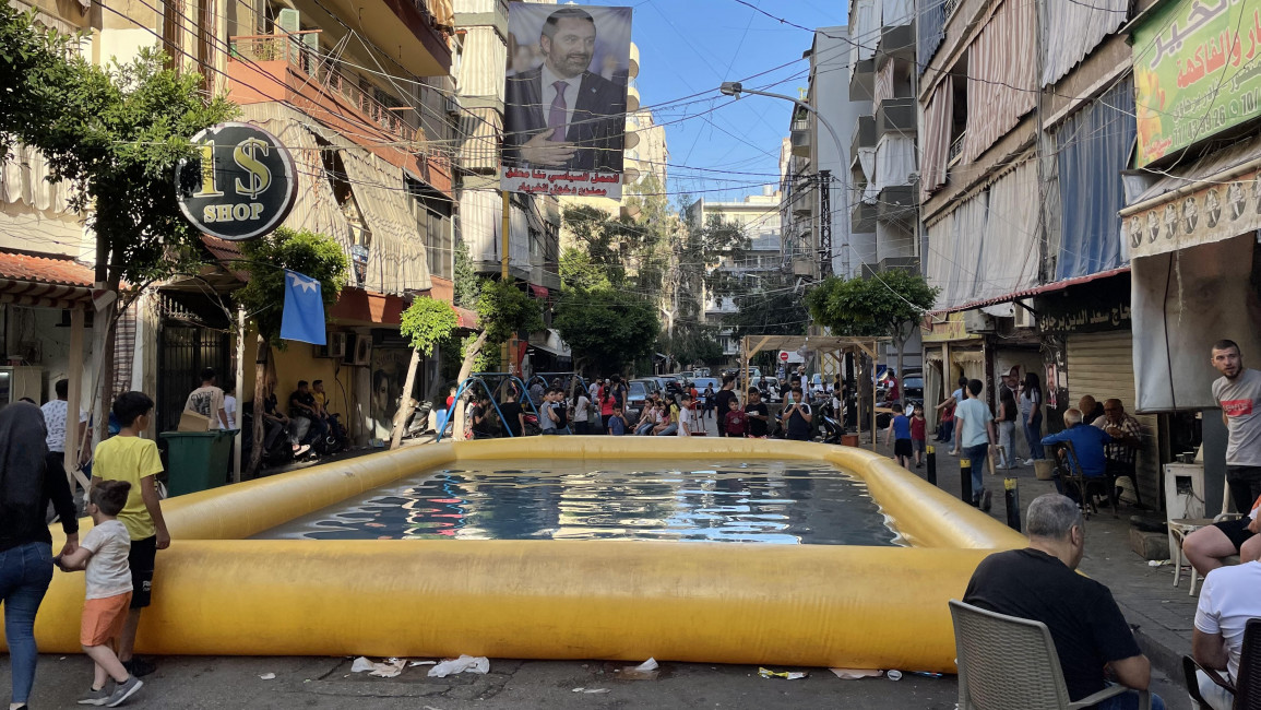 Supporters of Saad Hariri it around a pool to 'celebrate' not voting in protest of Hariri's absence in the 2022 election. (William Christou - TNA)