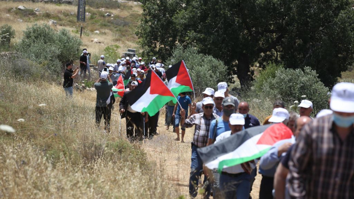 A group of Palestinian gather at Haris town during a protest against Jewish settlements planned to be built in the region, on the 53rd anniversary of the Six-Day War, which Arabs refer to as the "Naksa" ("Setback"), in Salfit, West Bank on June 05, 2020