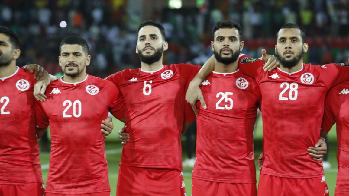 Tunisian football players standing together.
