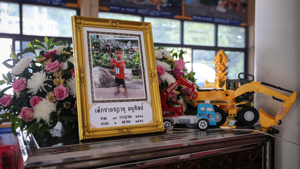 NONG BUA LAMPHU, THAILAND - OCTOBER 08: Offerings, toys and portraits placed for the victims are seen at the Wat Rak Samakee temple before funeral rites take place on October 08, 2022 in Uthai Sawan subdistrict, Nong Bua Lamphu, Thailand. Thai police said that former police officer Panya Kamrab, 34, had killed at least 36 people, including 24 children - some as young as 2 - in a mass shooting and stabbing at a child care center in northeast Thailand. The assailant subsequently shot himself and his family, p