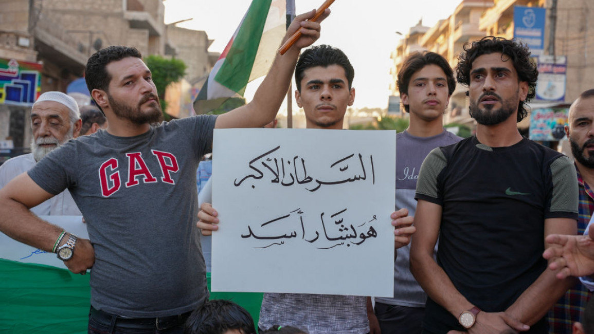 Syrians protested near the border crossing [Getty]