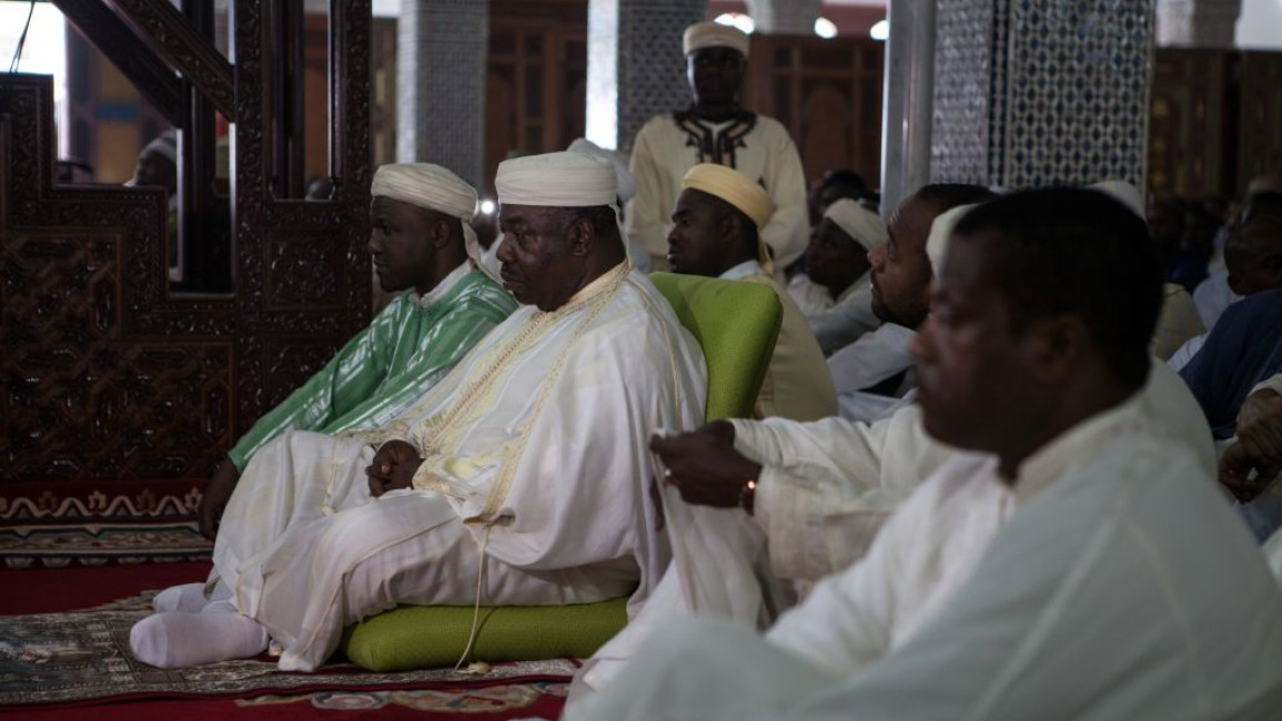 Ali Bongo (centre) takes part in Friday prayers in 2016 [Getty]
