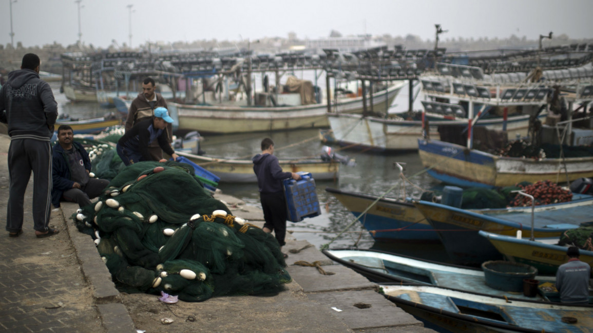 Fishermen at the port [AFP]