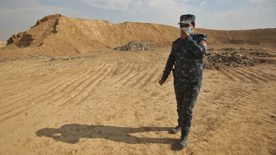 Iraq mass grave mosul -- AFP
