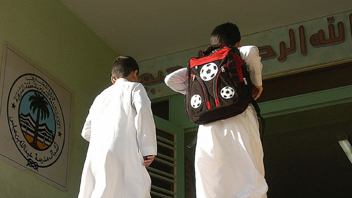 Saudi schoolboys entering their school [GETTY]