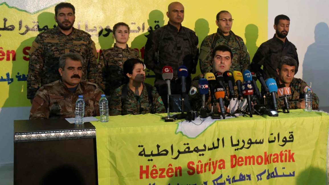 SDF spokesman Keno Gabriel holding a press conference