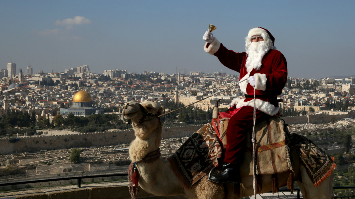 Father Christmas in Jerusalem [AFP]