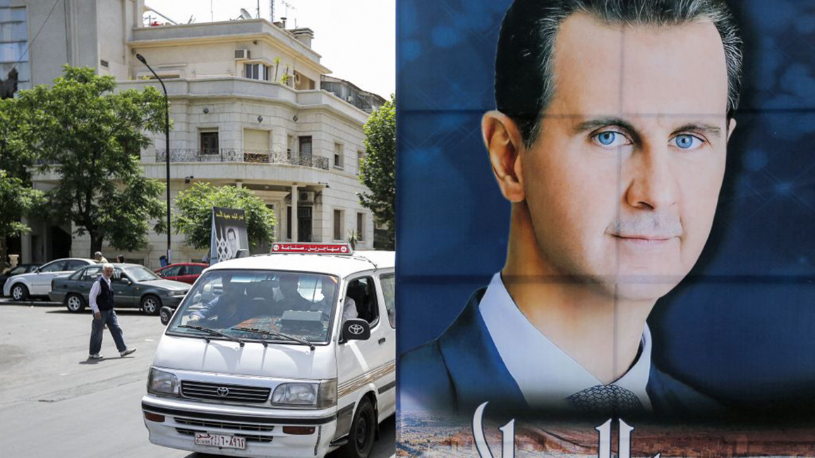 Assad poster [Getty]