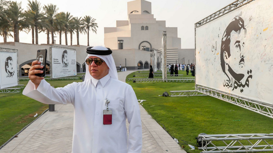  Qatari man at national unity art exhibition Doha