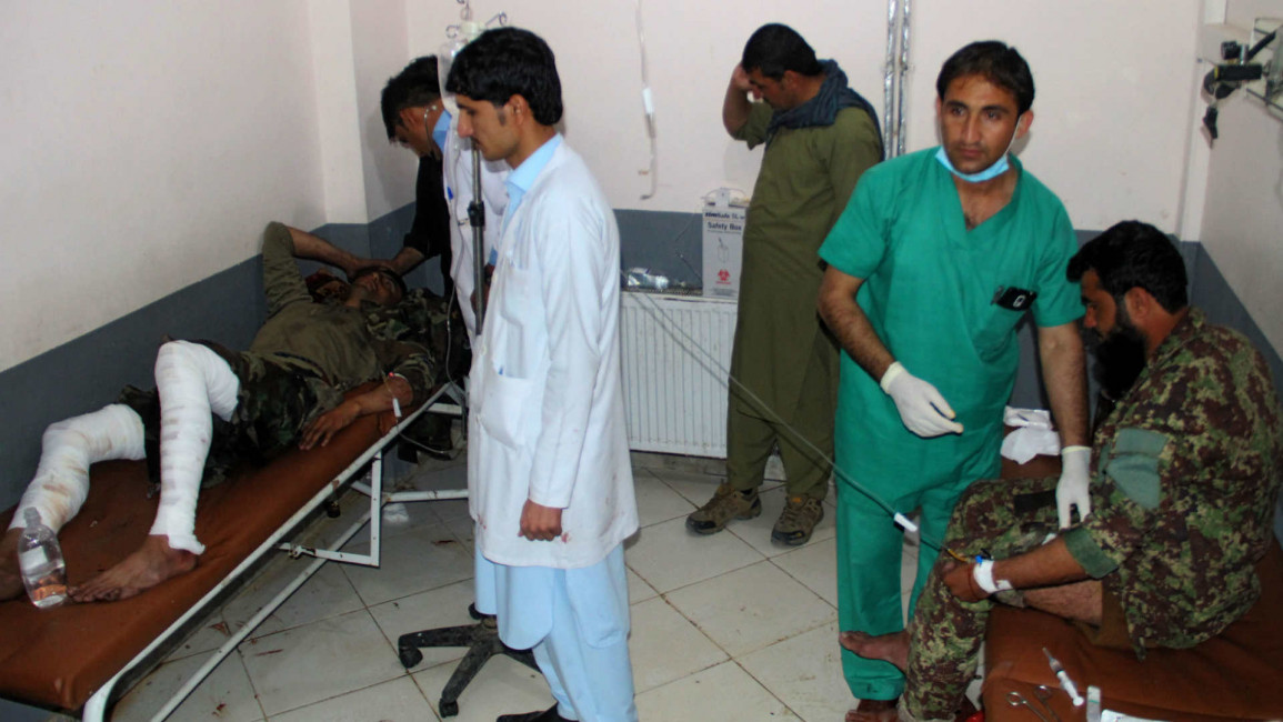 Afghan soldiers receiving medical treatment after a suicide blast