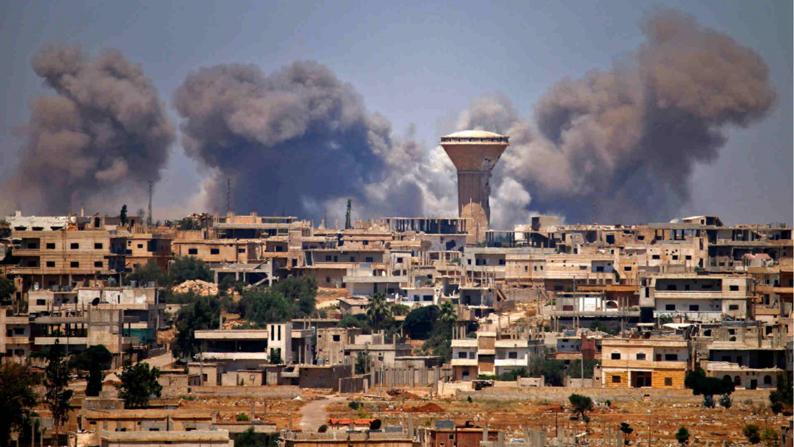 Smoke rises above Daraa