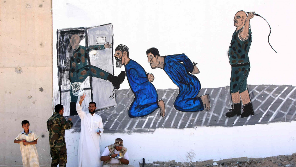 Mural depicting torture scene in Tripoli