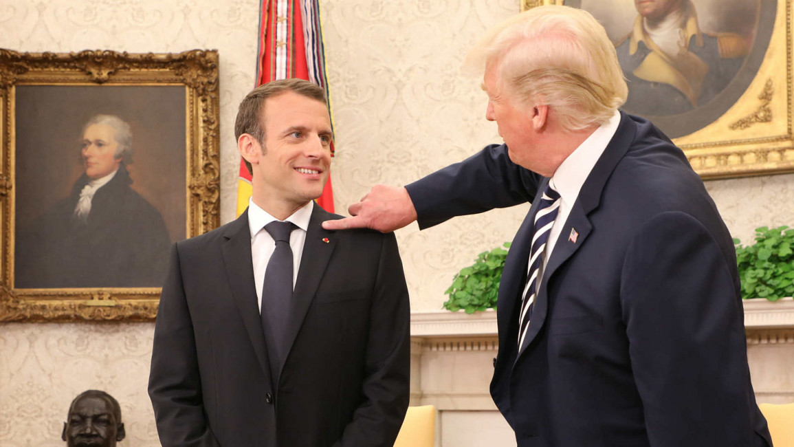 Trump wipes dandruff off Macron