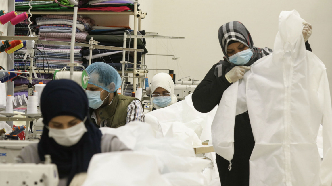 Workers produce protective clothing in city of Sidon