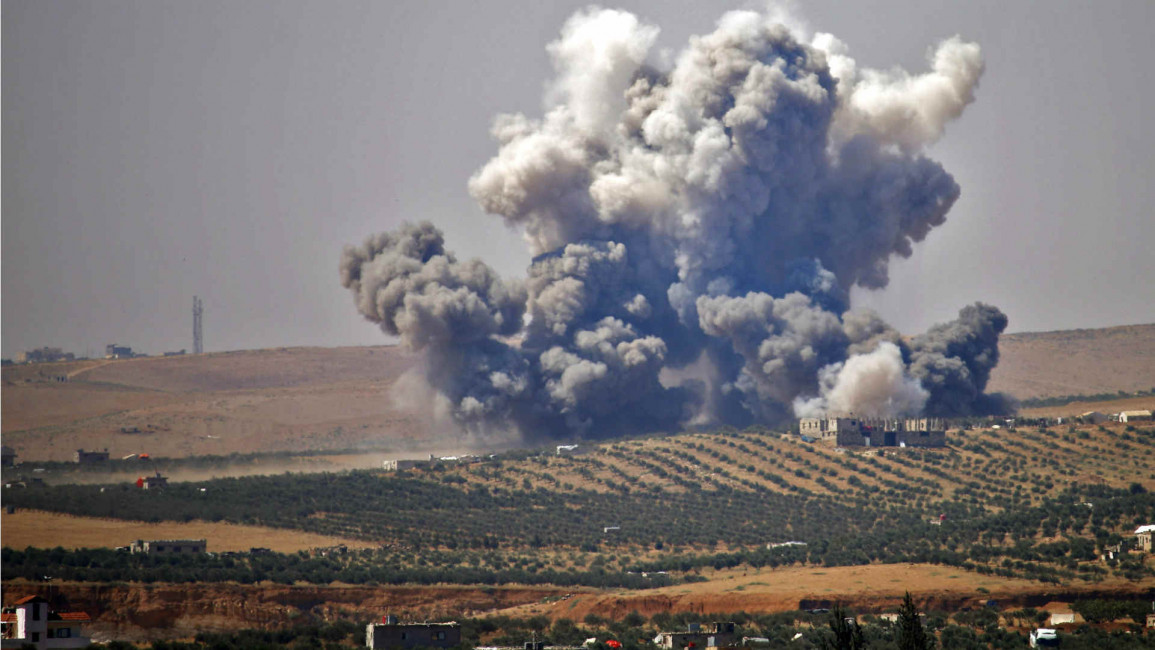 Smoke rises above rebel-held Daraa