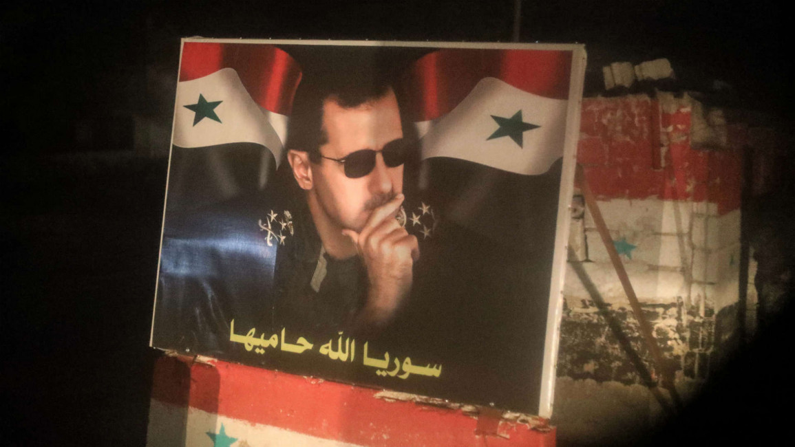 Poster of Assad at a checkpoint in Tartous