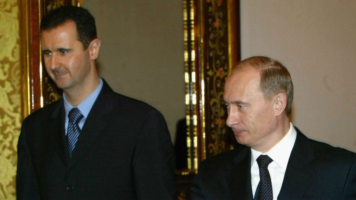 Assadm with Putin File Picture