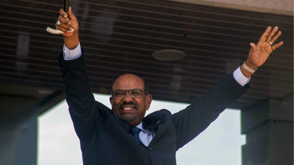 Sudan's President Omar al-Bashir gestures during