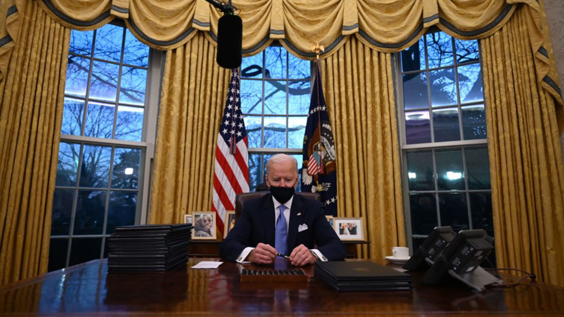 Biden sits in Oval Office [Getty]