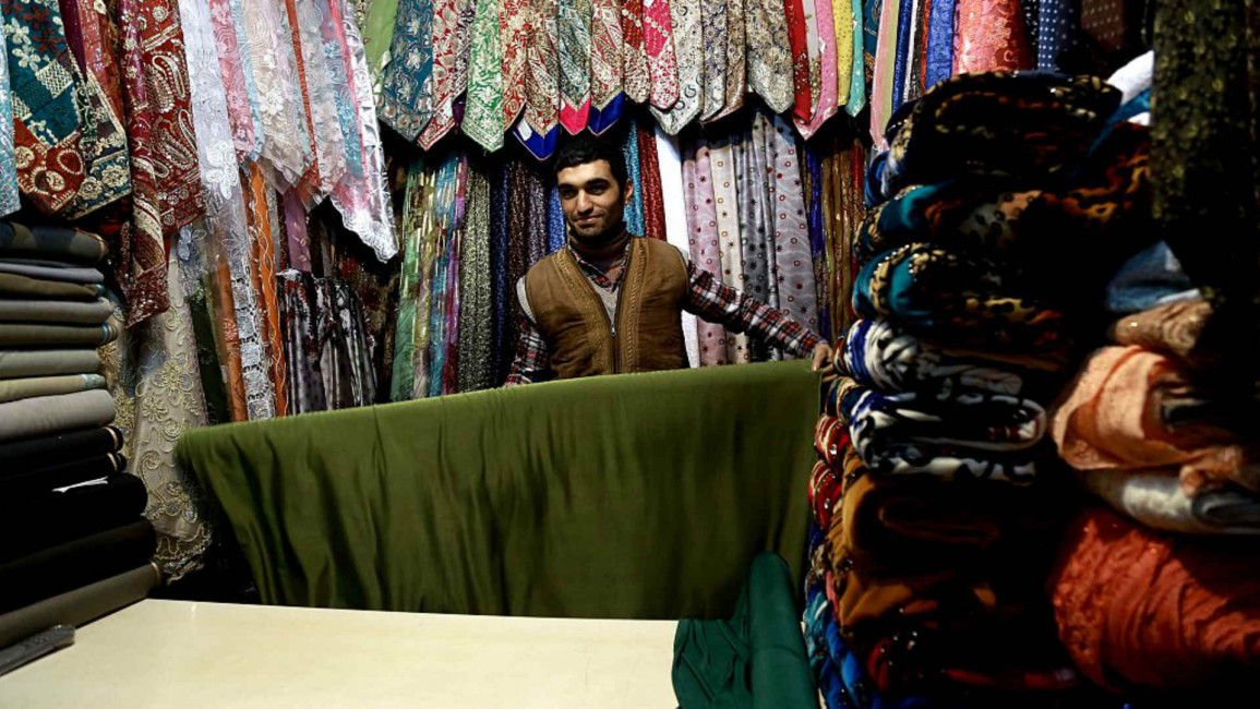 Syria cloth seller - AFP