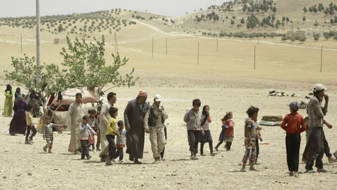 Syrians fleeing Manbij [AFP]