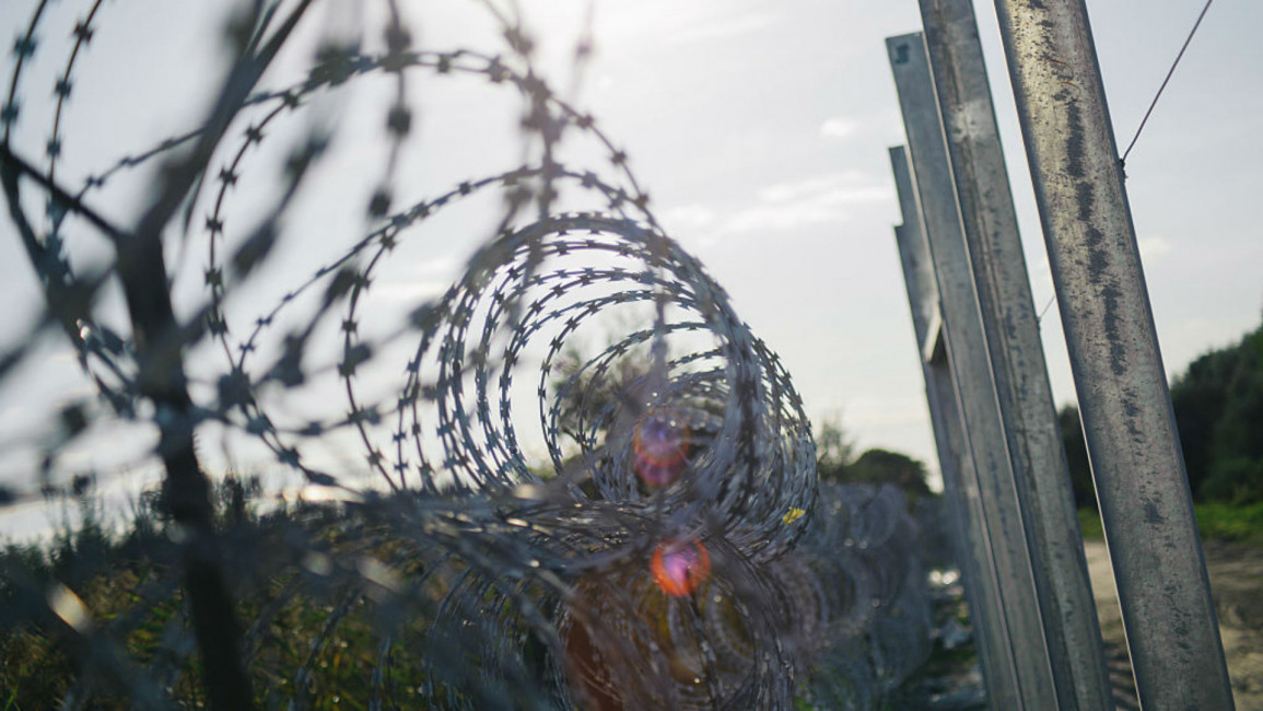 barbed wire prison - Getty