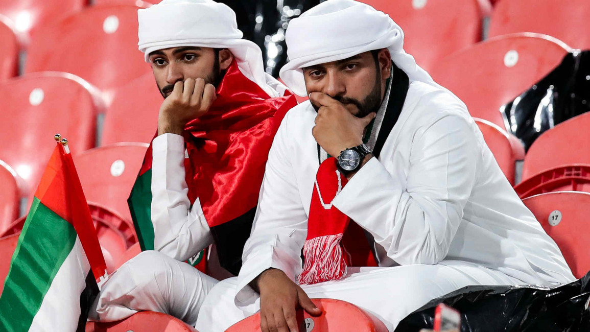 UAE fans dejected(Getty), Qatar fans celebrate (AFP