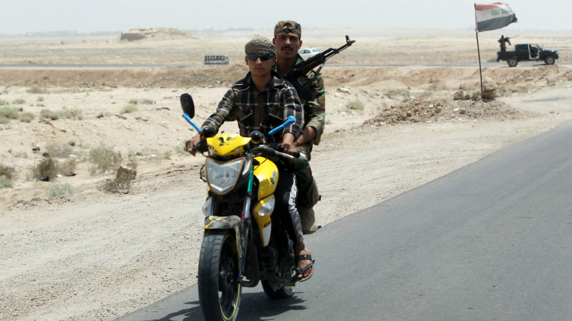 Iraqi Sunni fighters on motorcycle