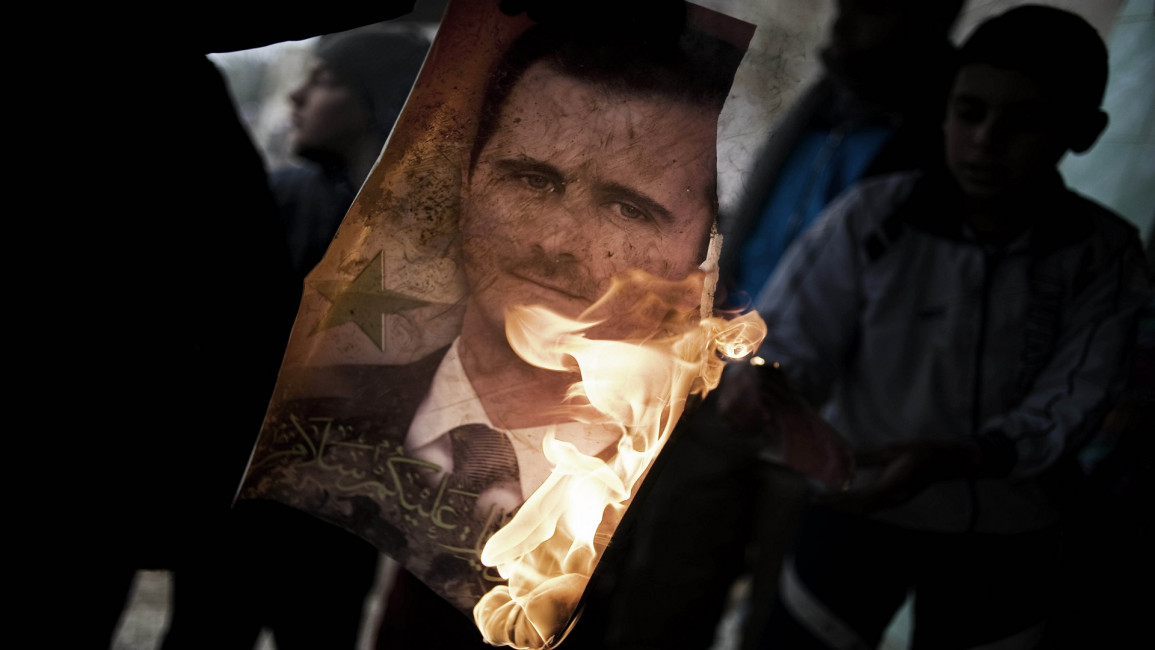 Assad burning photo protest