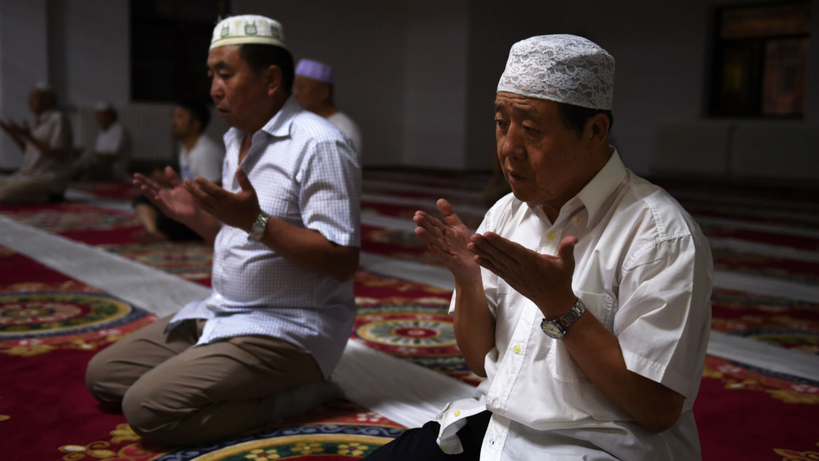 Xinjiang muslims [AFP]