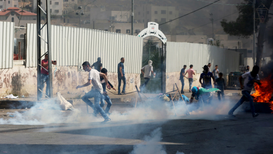 Palestininans clash Israeli forces - dont re-use image
