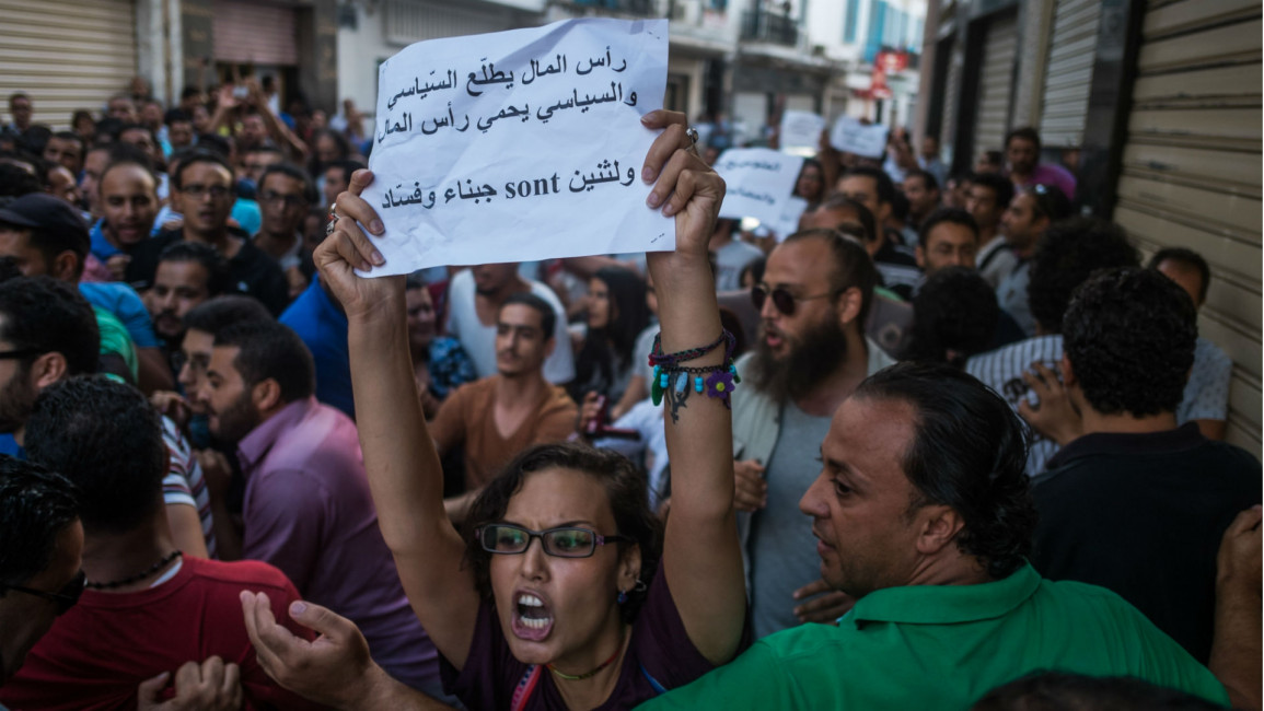 Tunisia protest economic reconciliation [Anadolu/Getty]