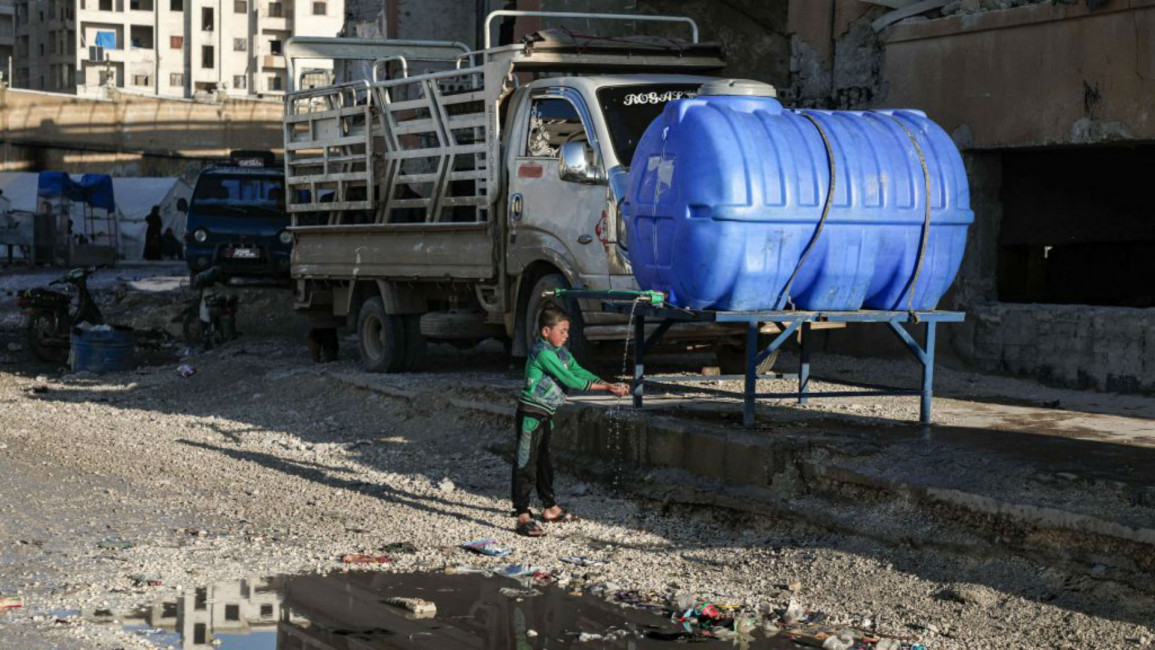 water tank Idlib camp - Getty