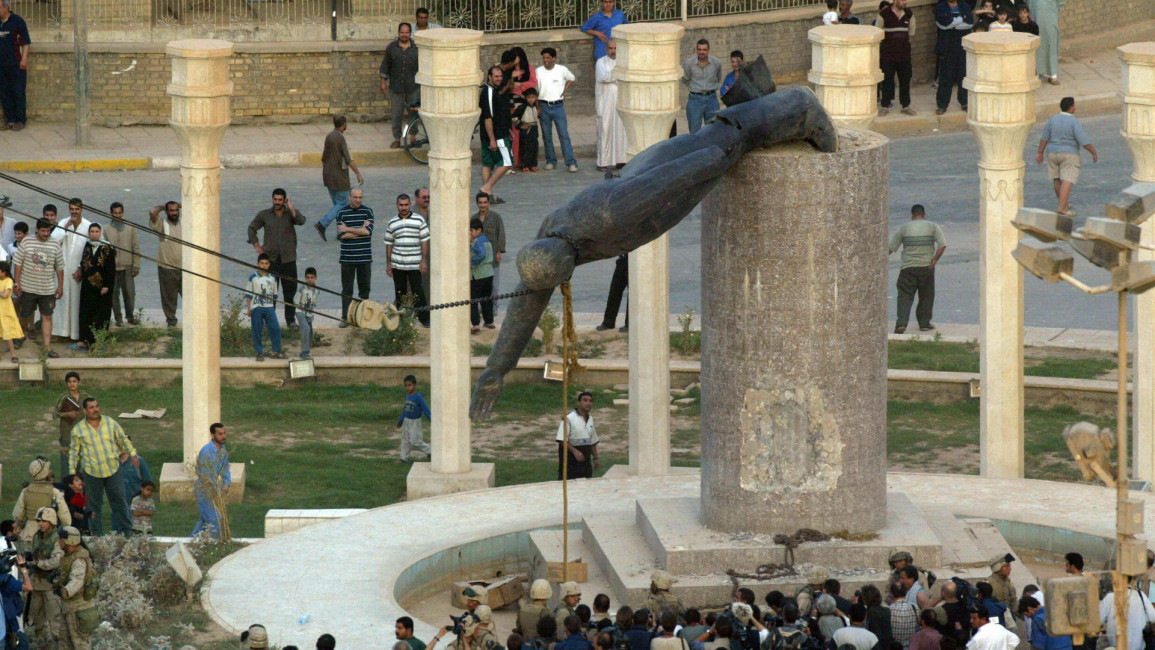 C:\Users\HENRIETTA\Pictures\saddam statue iraq.jpg