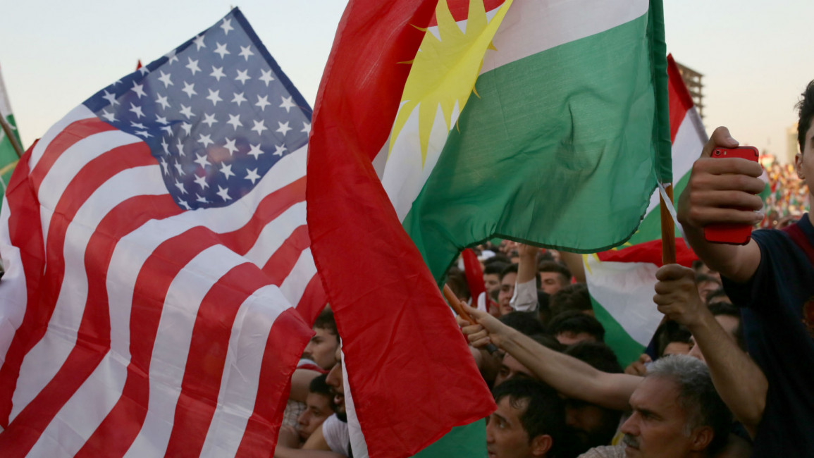 US and Kurdish flags ANADOLU