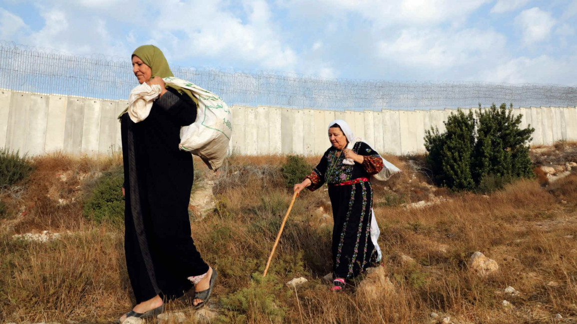Palestinian women west bank wall - Getty