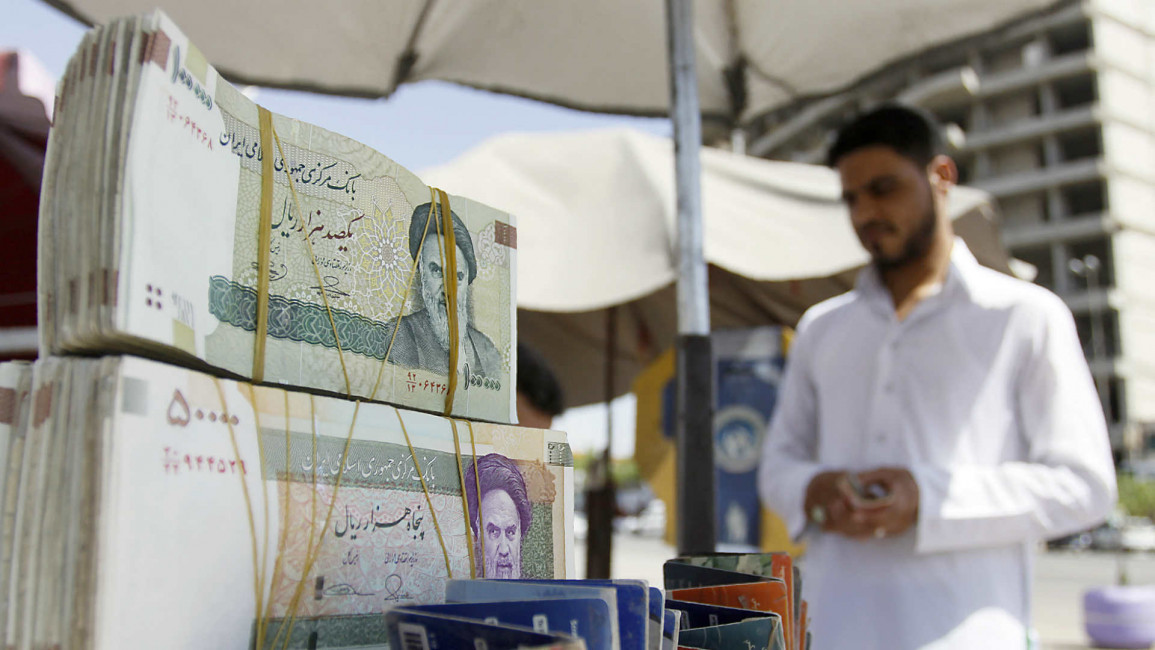 Iraqi vendor Iranian currency Riyal - Getty