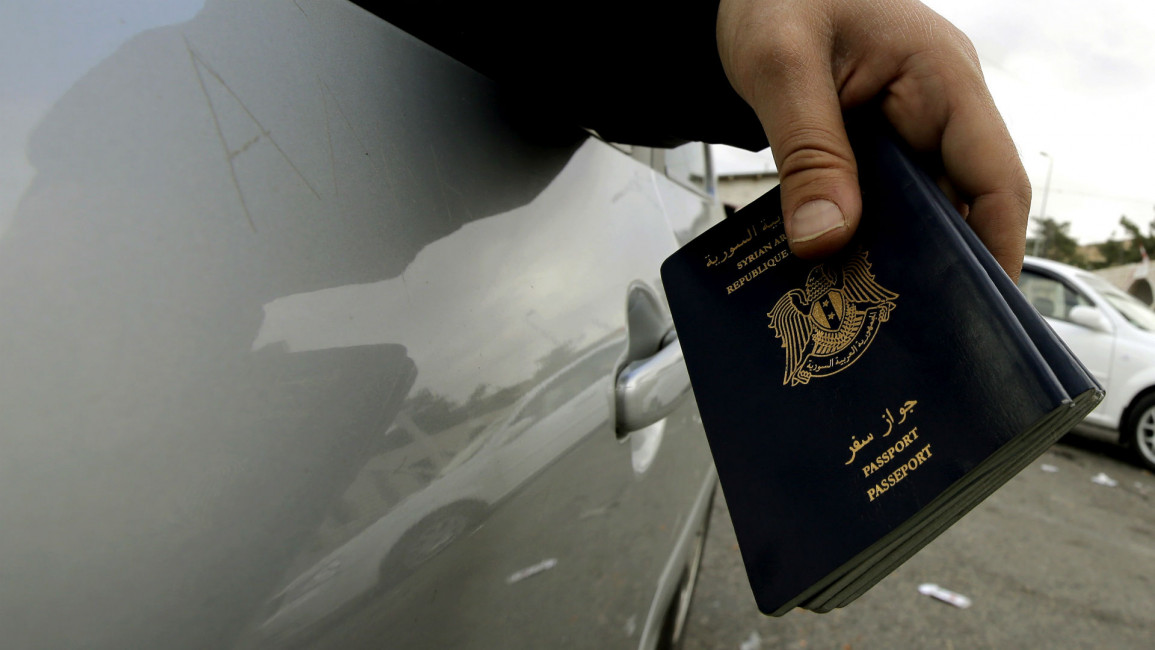 Syrian passports [AFP]