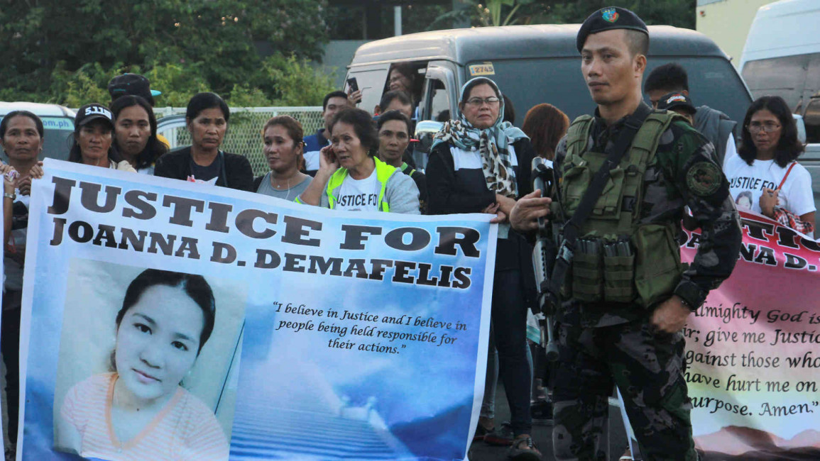 Relatives of Joanna Demafelis await her body in Manila