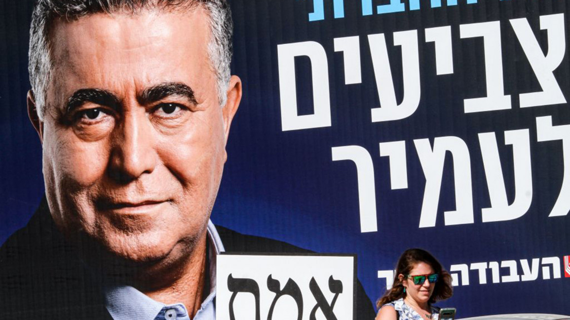 Labor Party campaign poster with Amir Peretz [Getty]