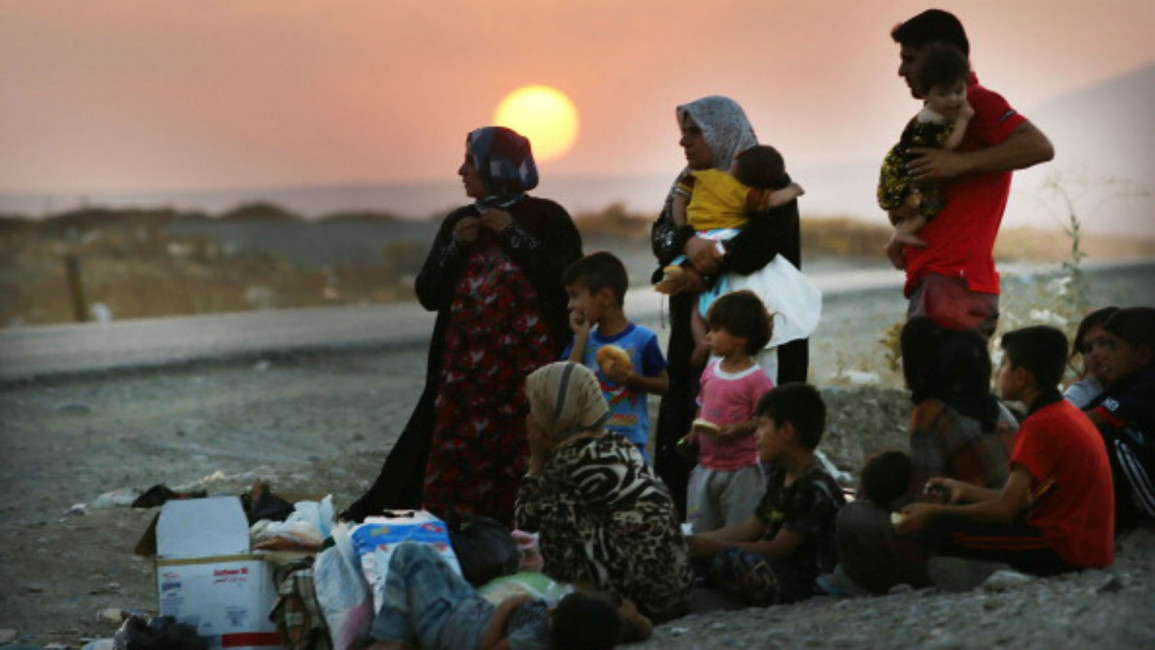 Iraqi civilians fleeing IS control [Getty]