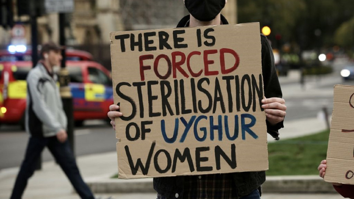Uighur women protest [GETTY]